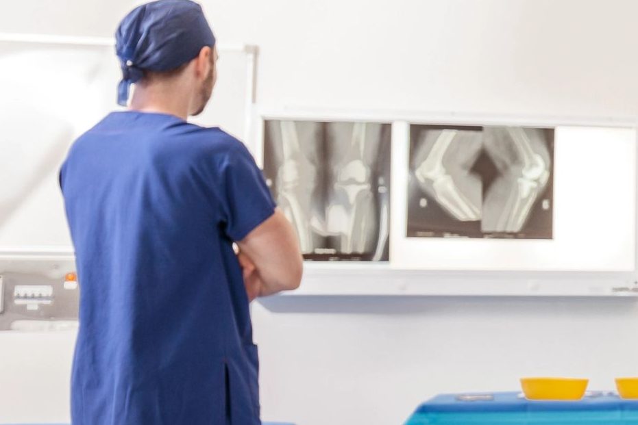 Distal femoral osteotomy: Dr Alexey Borshch reviewing knee X-rays in the operating theatre