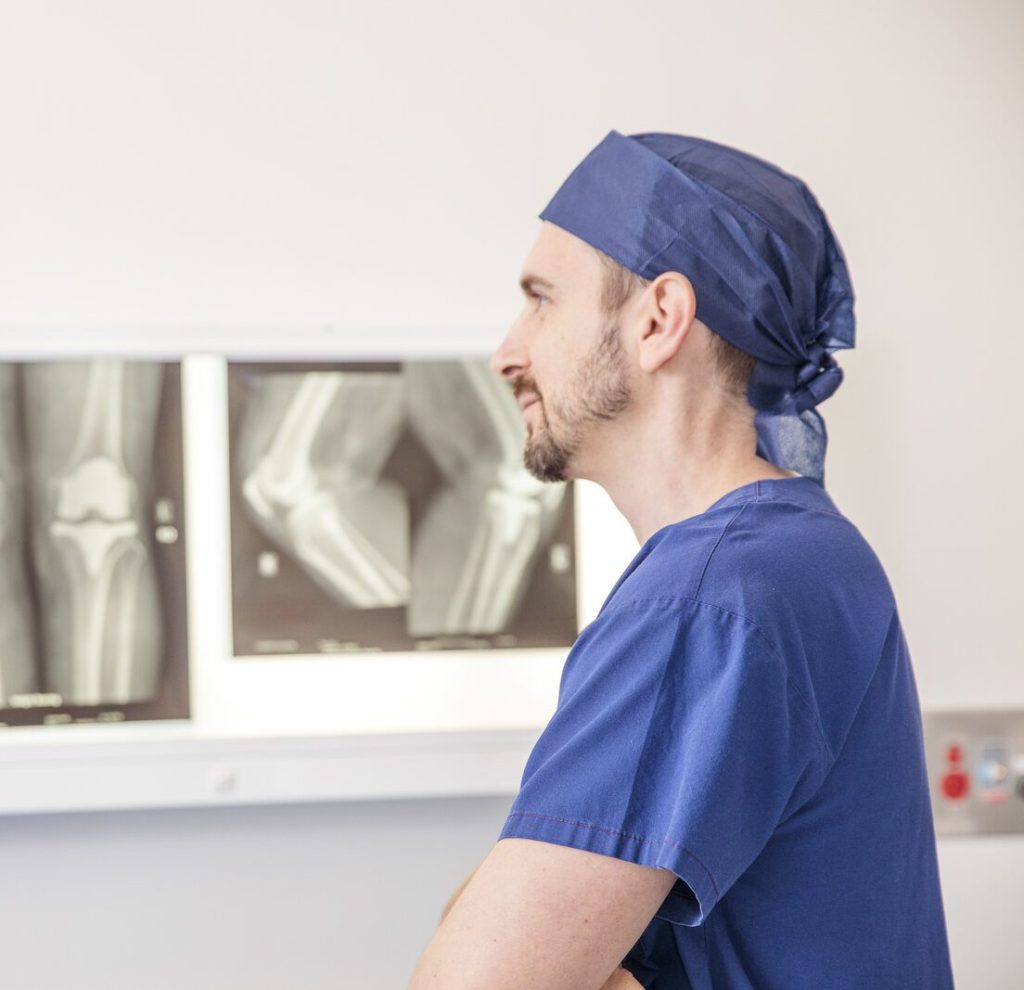 Dr Alexey Borshch reviewing knee X-rays